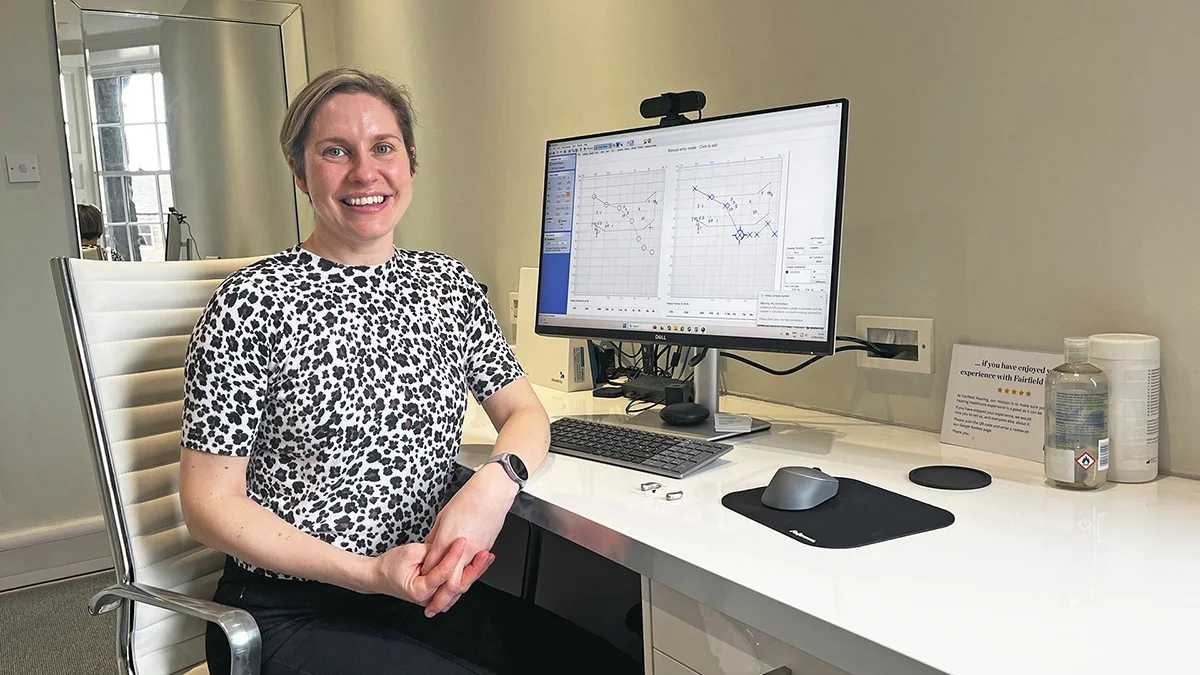 Louise Stewart, audiologist at Fairfield Hearing Edinburgh, reviewing hearing assessment results during a patient consultation.